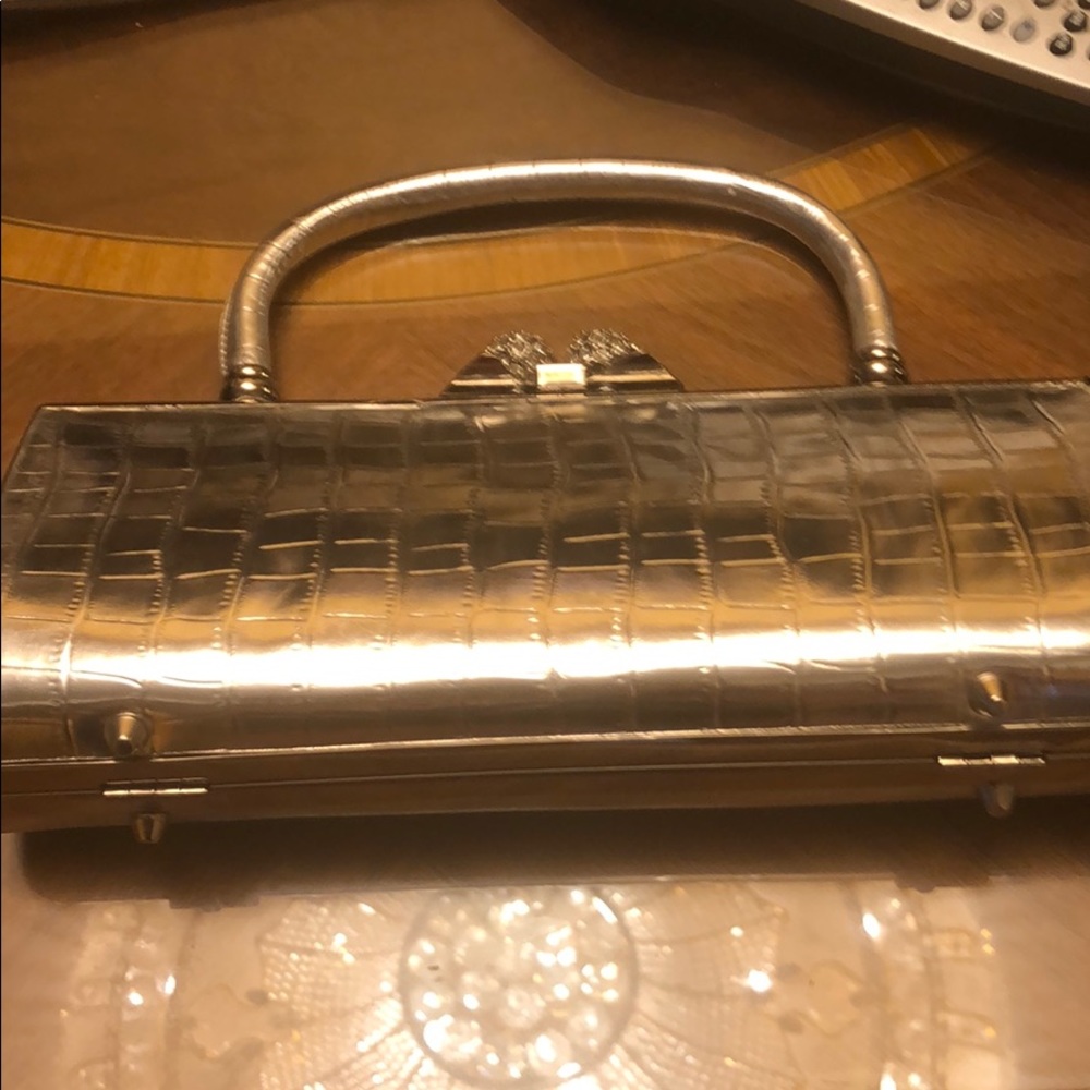 Dressy silver purse. Rhinestone clasp.